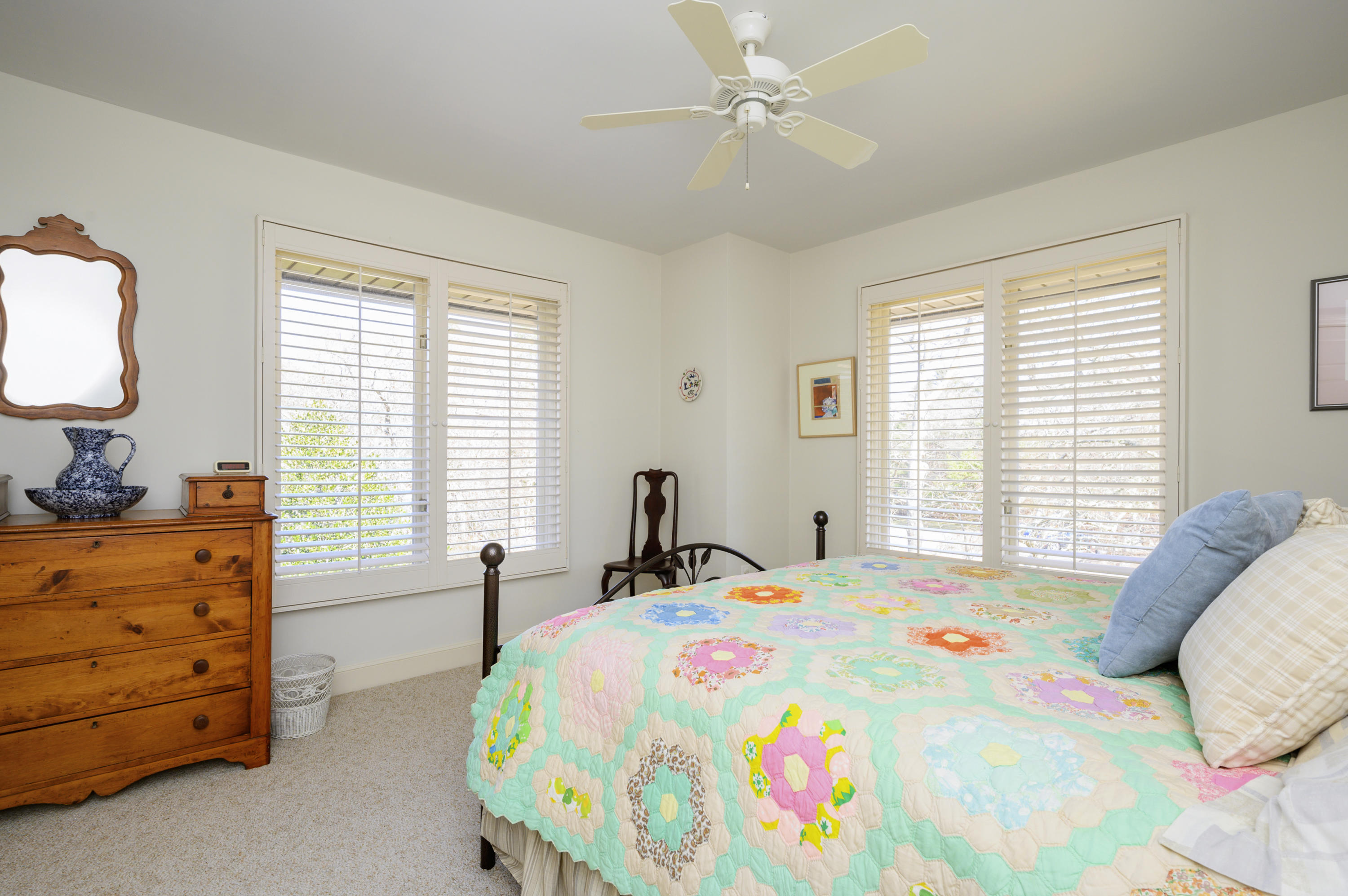 2 Dogwood Road, Unit H Buzzards Bay, MA 02532 - Photo 23 of 41 a bedroom with a bed and a table in it