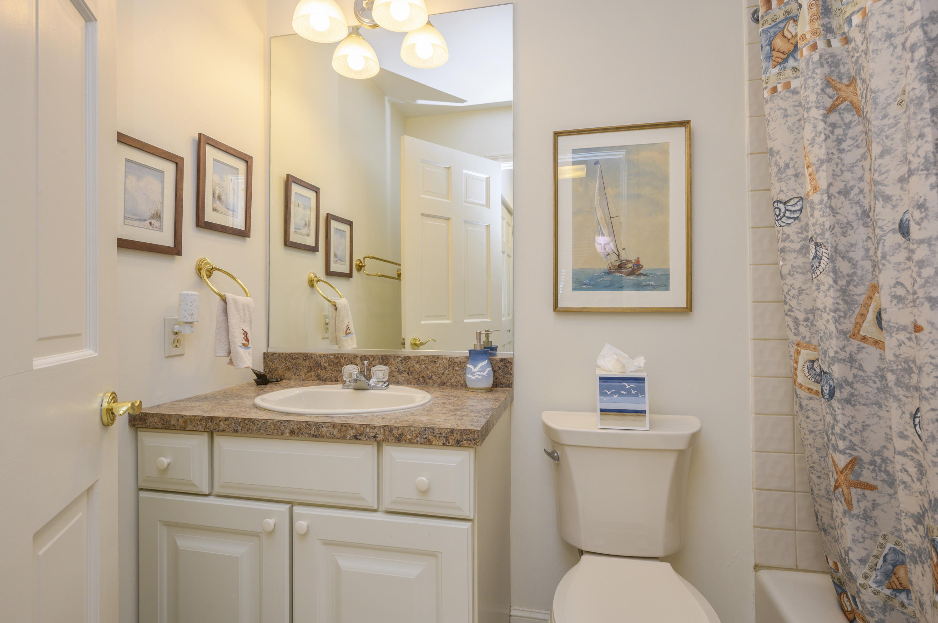 2 Dogwood Road, Unit H Buzzards Bay, MA 02532 - Photo 25 of 41 a bathroom with a granite countertop sink mirror vanity and toilet