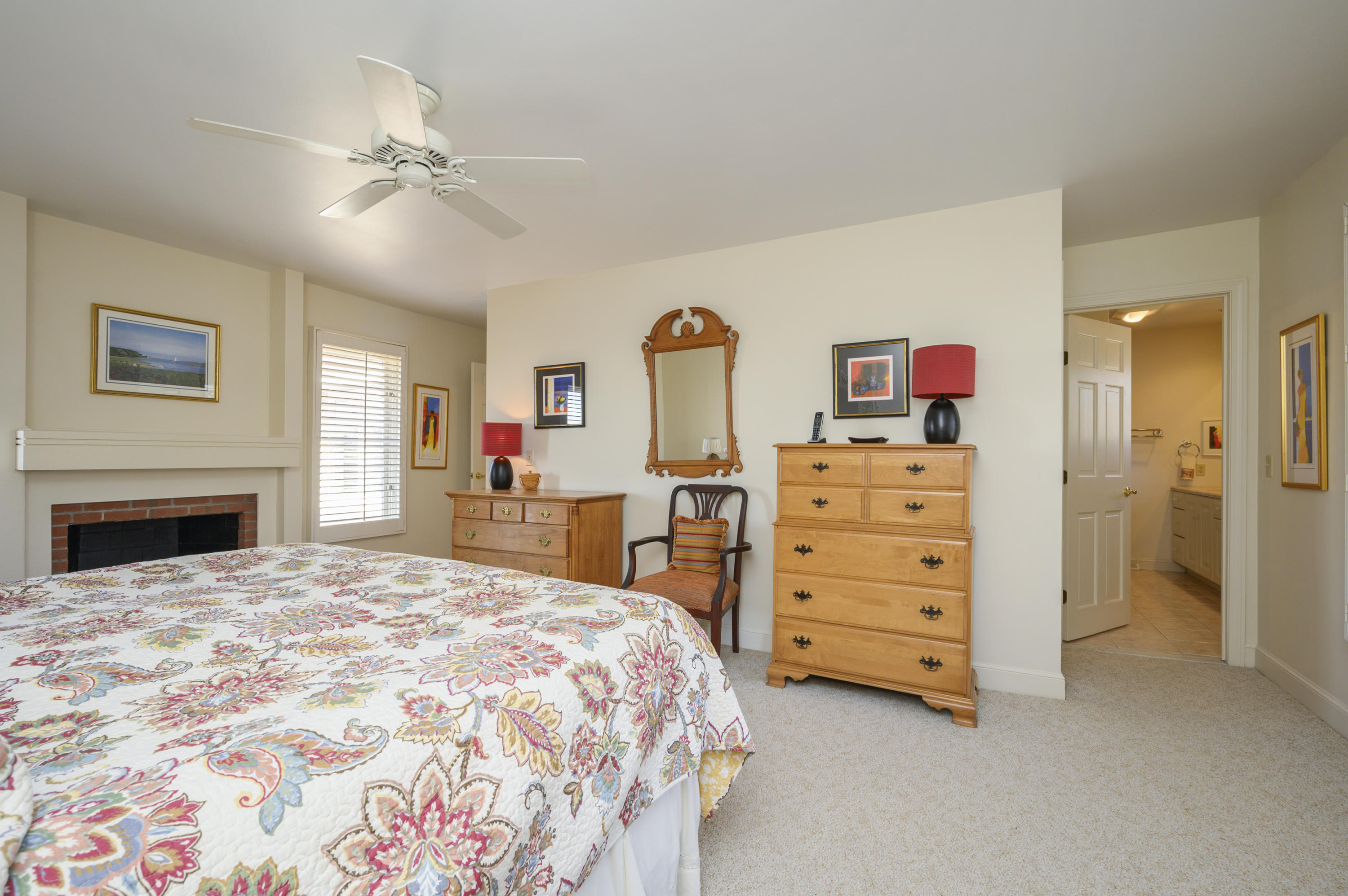 2 Dogwood Road, Unit H Buzzards Bay, MA 02532 - Photo 28 of 41 a bedroom with a bed and a chandelier