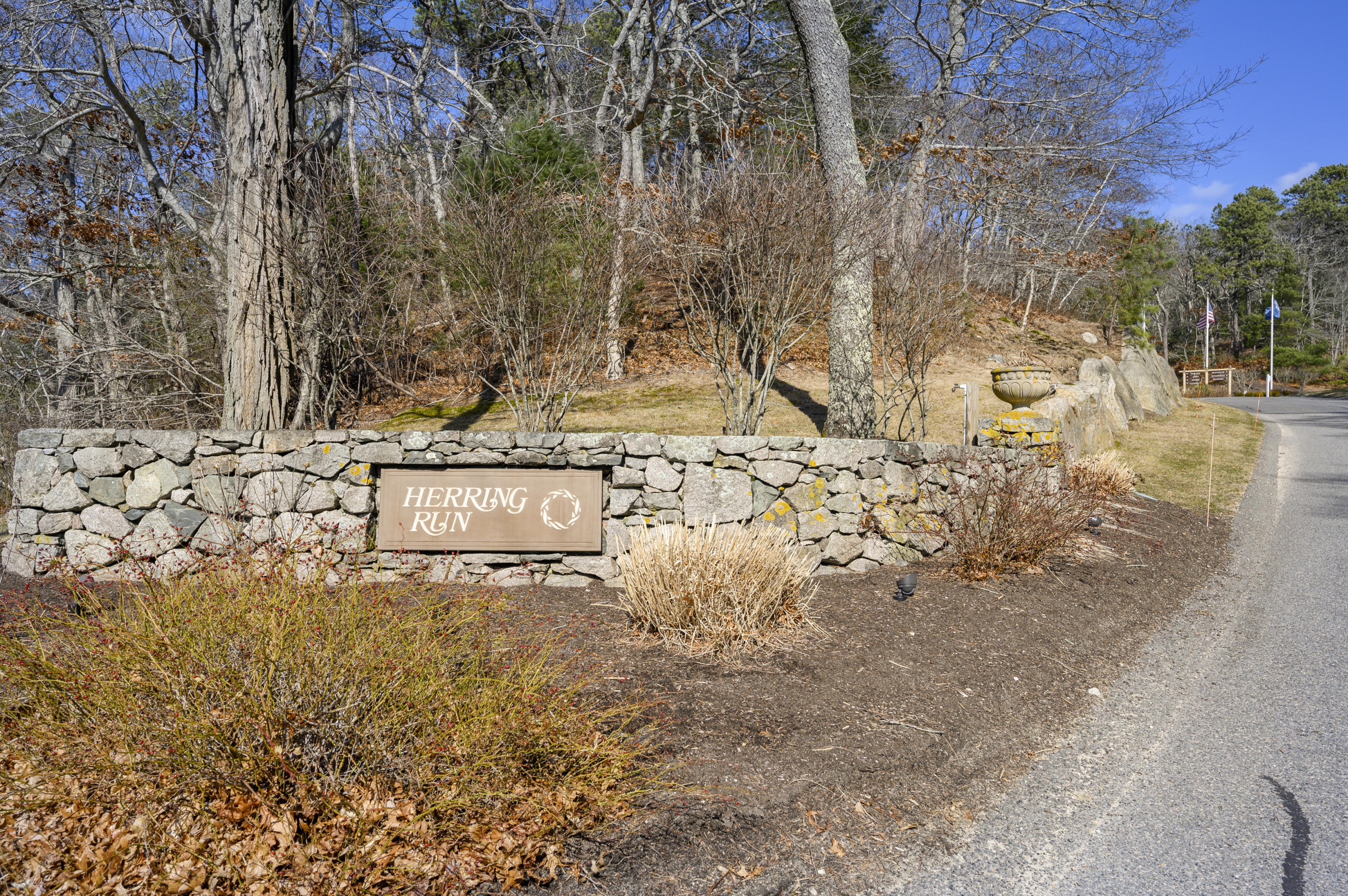 2 Dogwood Road, Unit H Buzzards Bay, MA 02532 - Photo 41 of 41 a view of a wooden wall under a large tree