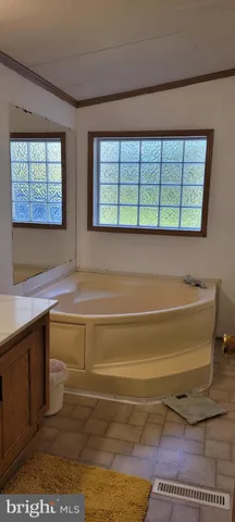 a bathroom with a sink and a large window