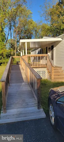 a view of a house with wooden deck