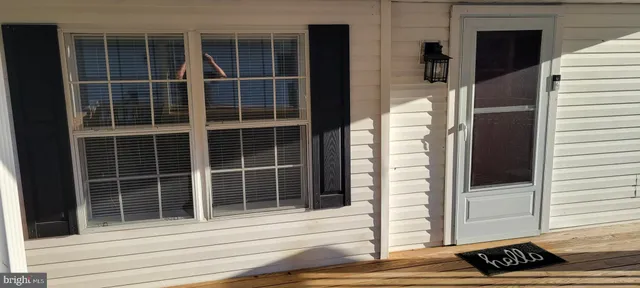 a view of a door and a window