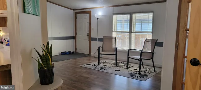 a view of a livingroom with furniture and windows