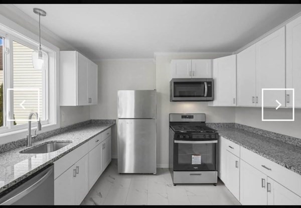 28 Borden Street, Unit 1 New Bedford, MA 02740 - Photo 4 of 11 a kitchen with granite countertop a refrigerator and a sink