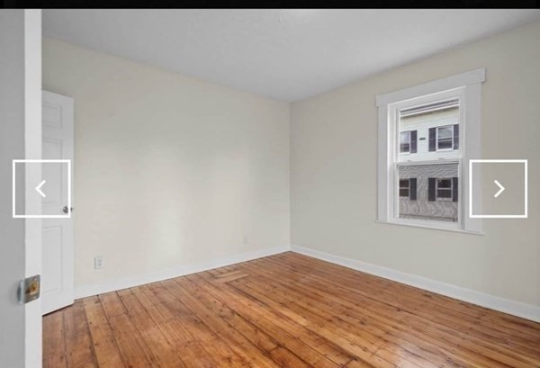 28 Borden Street, Unit 1 New Bedford, MA 02740 - Photo 9 of 11 a view of empty room with wooden floor