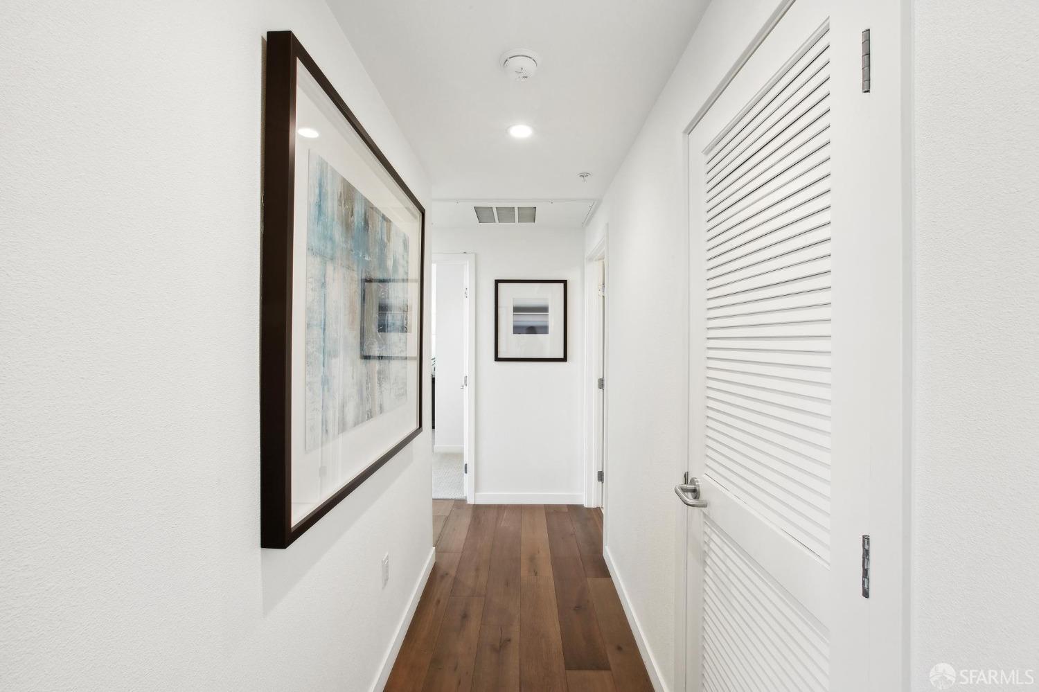 2655 Bush Street, Unit 603 San Francisco, CA 94115 - Photo 13 of 36 a view of a hallway with wooden floor