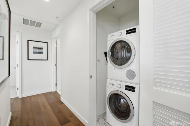 a view of a hallway with living room