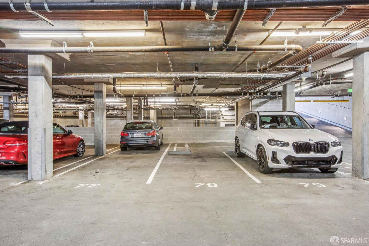 2655 Bush Street, Unit 603 San Francisco, CA 94115 - Photo 16 of 36 a view of parking garage with cars parked