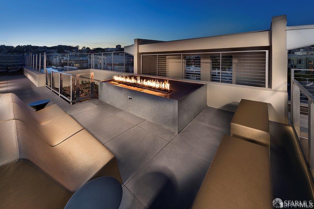 2655 Bush Street, Unit 603 San Francisco, CA 94115 - Photo 20 of 36 a roof deck with couches and wooden floor