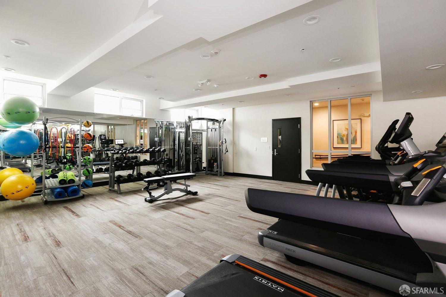 2655 Bush Street, Unit 603 San Francisco, CA 94115 - Photo 24 of 36 a living room with furniture and wooden floor