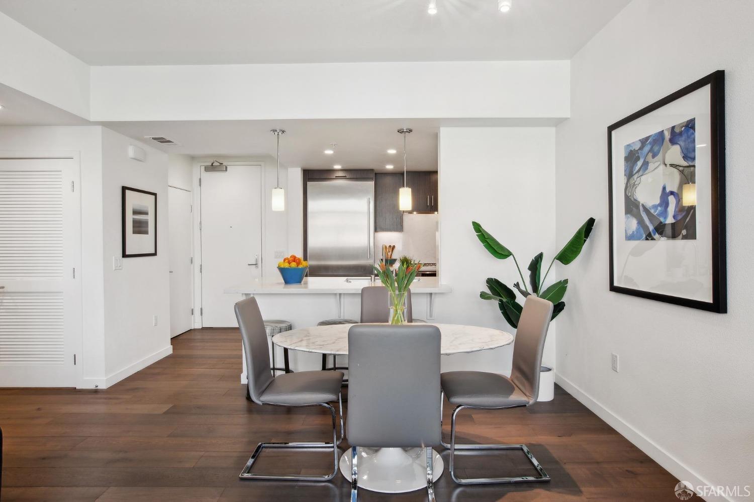 2655 Bush Street, Unit 603 San Francisco, CA 94115 - Photo 3 of 36 a living room with furniture and wooden floor