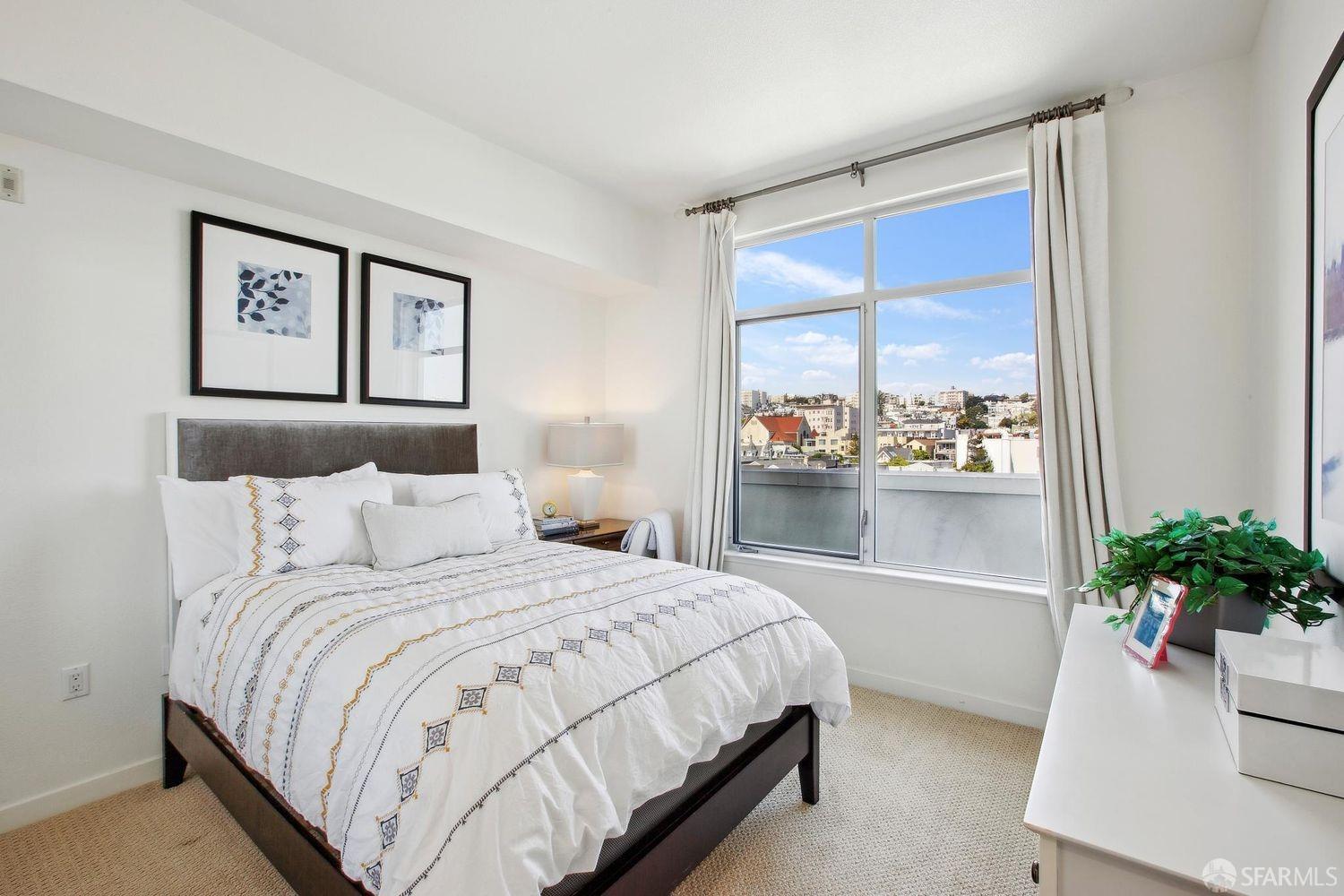 2655 Bush Street, Unit 603 San Francisco, CA 94115 - Photo 7 of 36 a bedroom with a bed and a potted plant