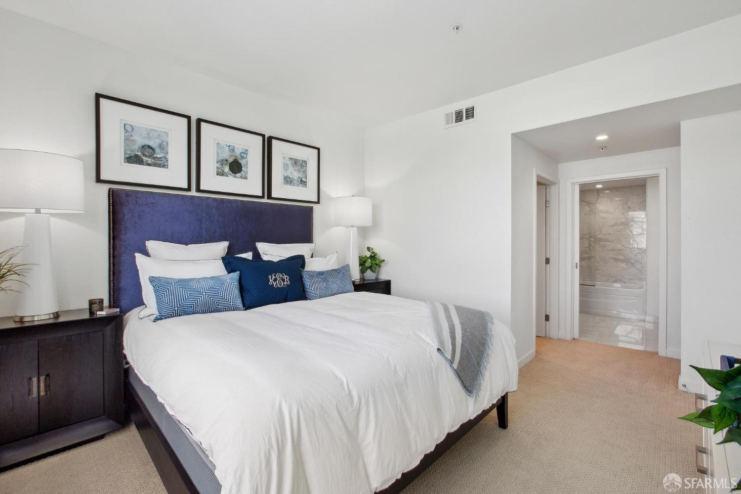 2655 Bush Street, Unit 603 San Francisco, CA 94115 - Photo 10 of 36 a bedroom with a bed and painting on the wall