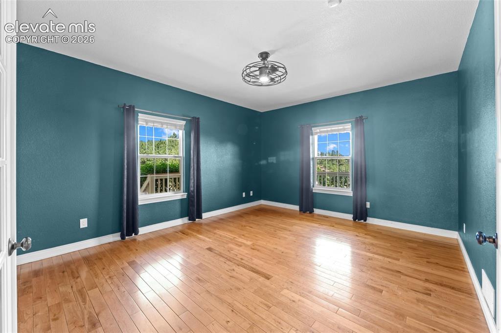 16540 Mesquite Road Peyton, CO 80831 - Photo 16 of 50 a bedroom with a bed and a window