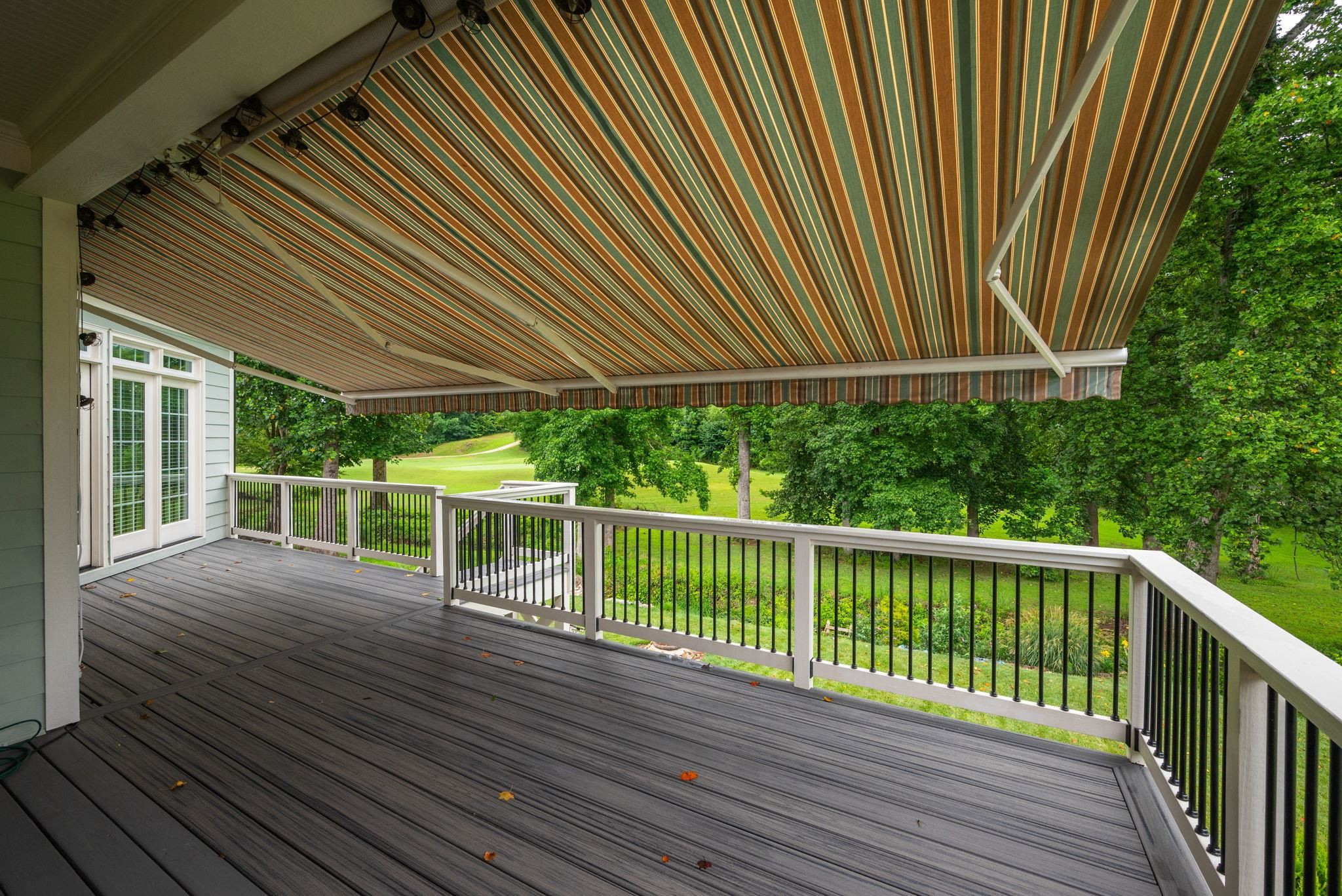 137 St Mellion Street Raleigh, NC 27603 - Photo 37 of 50 Retractable Awning Provides Cover While You Watch Golfers on the 10th