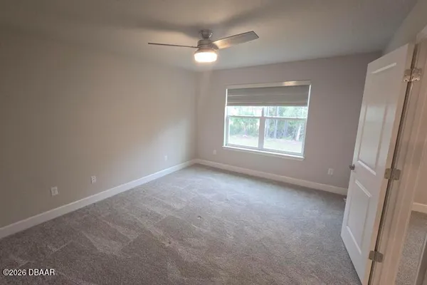 a bathroom with a shower a toilet and a sink