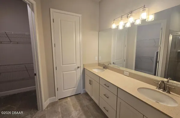a bathroom with a glass shower door