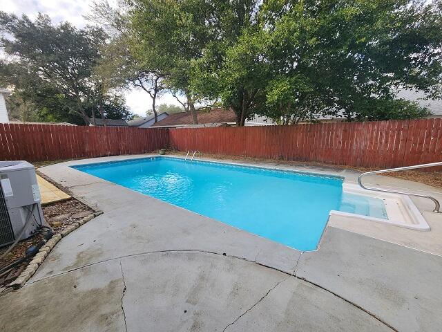 1038 37th Street Niceville, FL 32578 - Photo 1 of 25 a view of a backyard with lawn chairs and a large tree