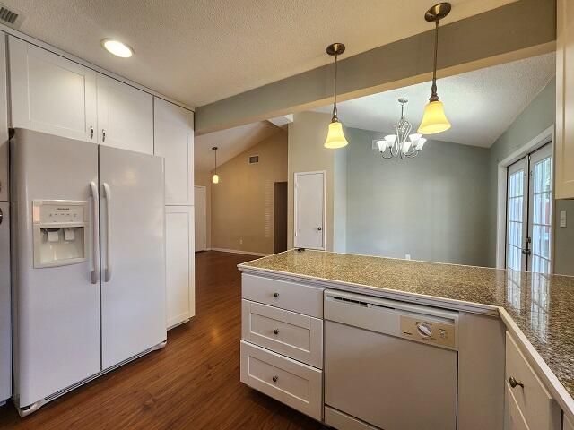 1038 37th Street Niceville, FL 32578 - Photo 11 of 25 a kitchen with a refrigerator and a wooden floor