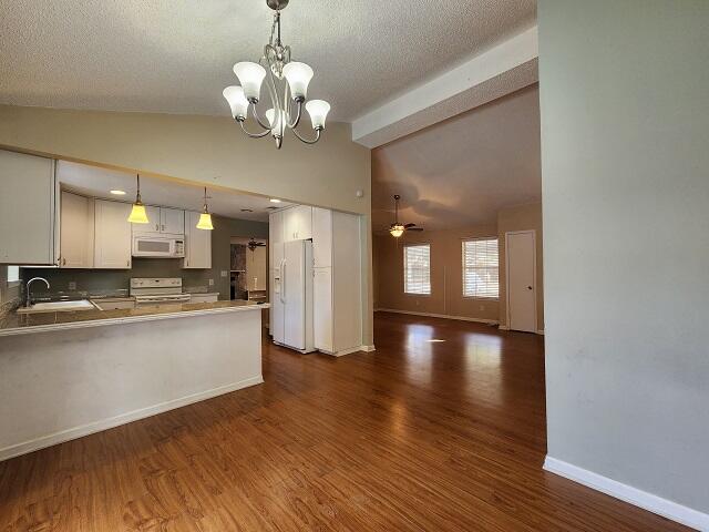 1038 37th Street Niceville, FL 32578 - Photo 12 of 25 a view of a kitchen with a dishwasher cabinets and a large window