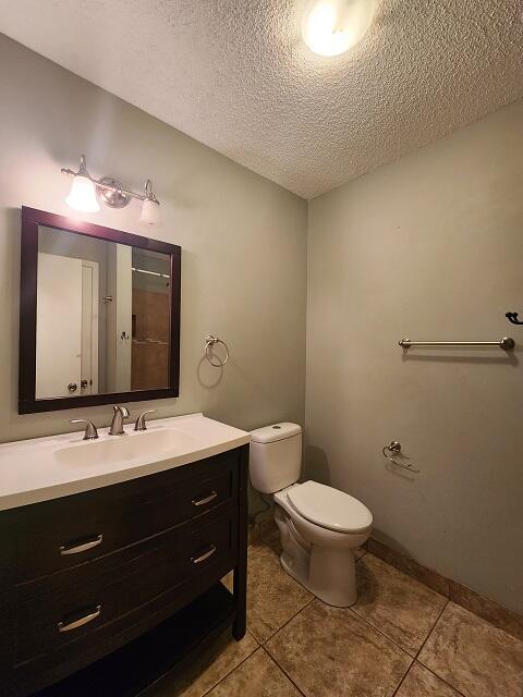 1038 37th Street Niceville, FL 32578 - Photo 14 of 25 a bathroom with a toilet a sink and mirror