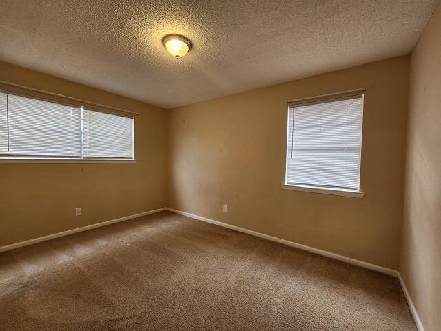 1038 37th Street Niceville, FL 32578 - Photo 17 of 25 an empty room with a window