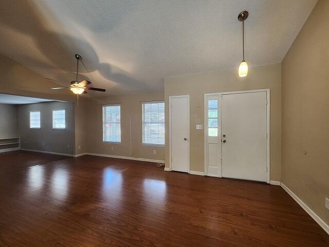 1038 37th Street Niceville, FL 32578 - Photo 3 of 25 a view of an empty room with window and wooden floor