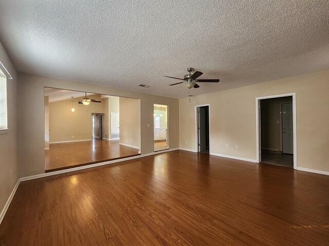 1038 37th Street Niceville, FL 32578 - Photo 6 of 25 a view of empty room with wooden floor and fan