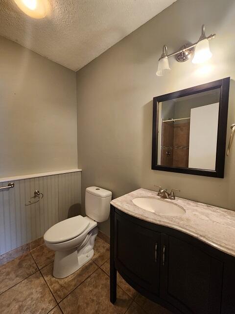 1038 37th Street Niceville, FL 32578 - Photo 7 of 25 a bathroom with a granite countertop sink a large mirror and toilet