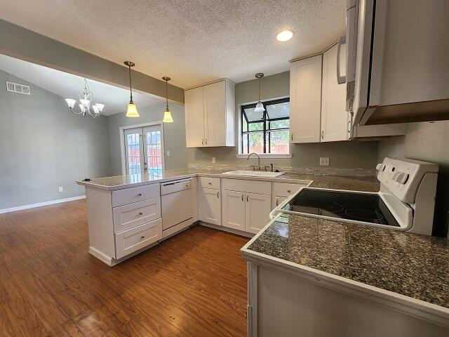1038 37th Street Niceville, FL 32578 - Photo 10 of 25 a kitchen with granite countertop a sink a counter space appliances and cabinets