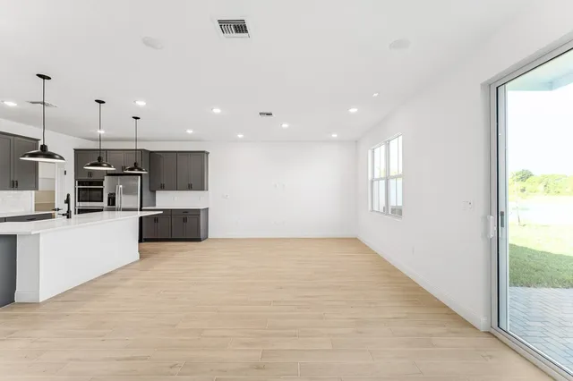 a view of kitchen with wooden floor