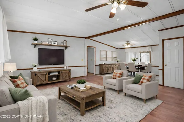 a living room with furniture and a flat screen tv