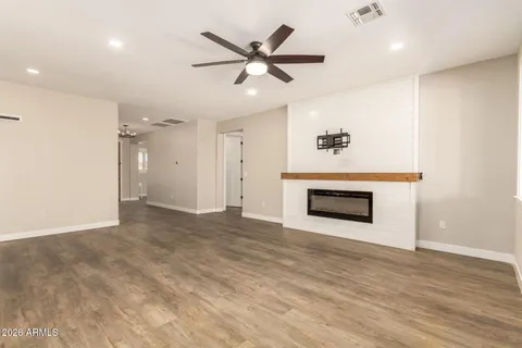 a spacious bathroom with double vanity and mirrors