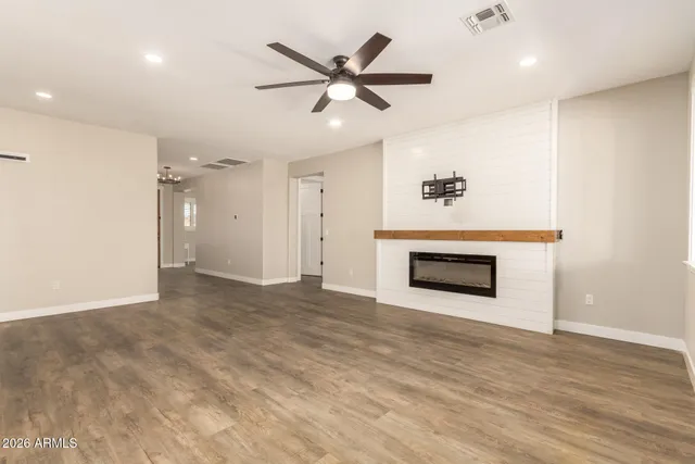 a kitchen with stainless steel appliances a refrigerator and a stove top oven