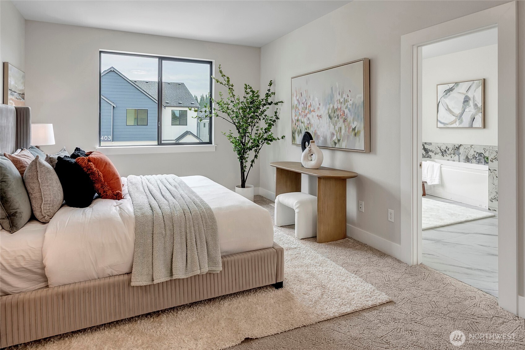 3928 214th Place Southeast, Unit B Bothell, WA 98021 - Photo 17 of 27 a bedroom with a large bed and a chandelier