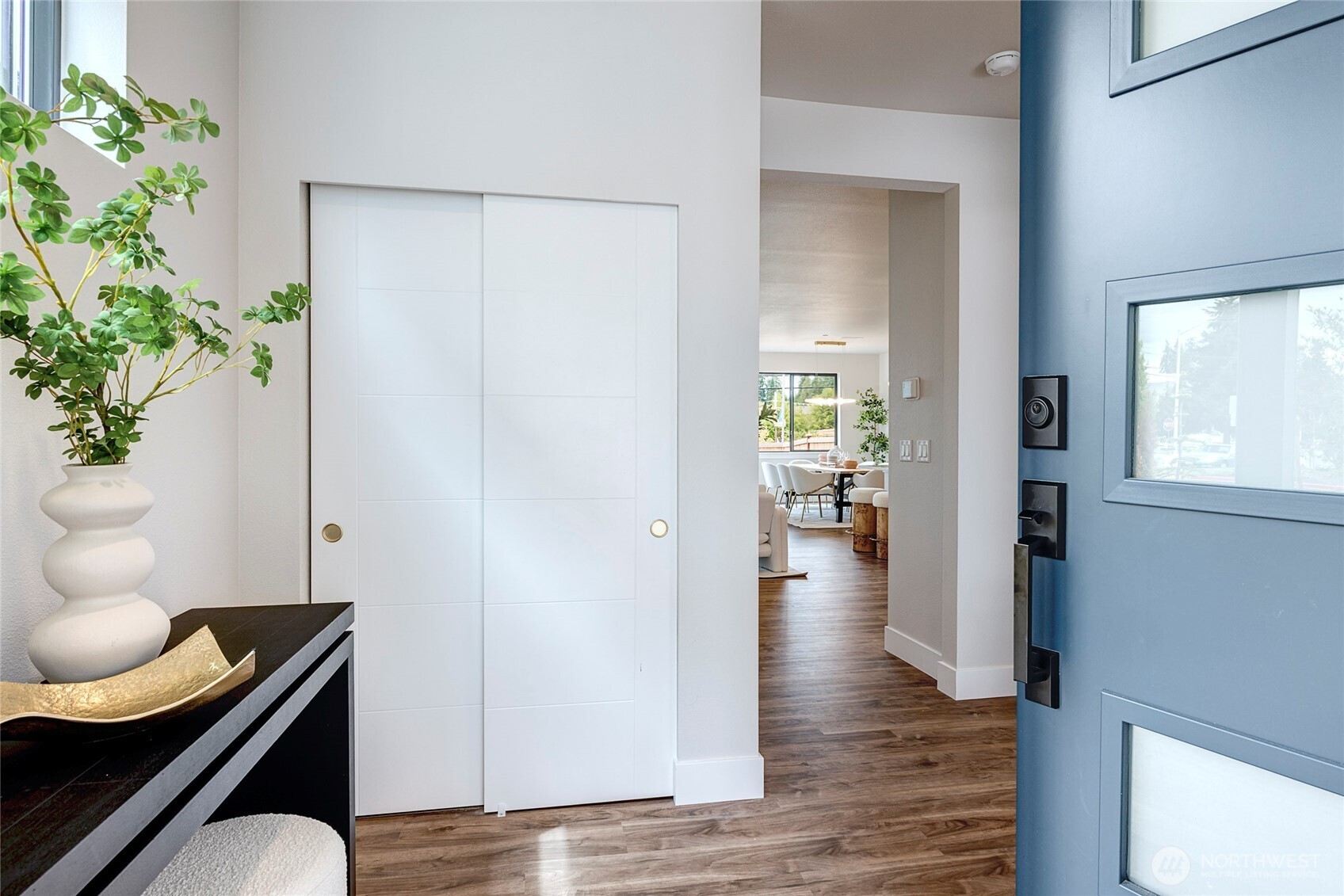 3928 214th Place Southeast, Unit B Bothell, WA 98021 - Photo 2 of 27 a view of a hallway with wooden floor and a potted plant