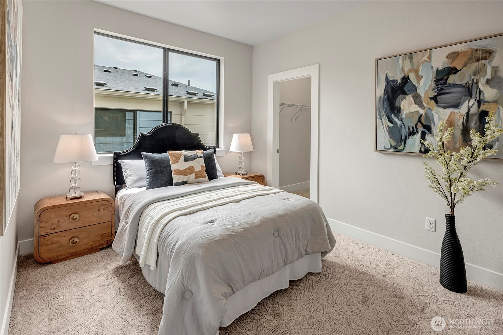 3928 214th Place Southeast, Unit B Bothell, WA 98021 - Photo 22 of 27 a bedroom with a bed and a painting on the wall