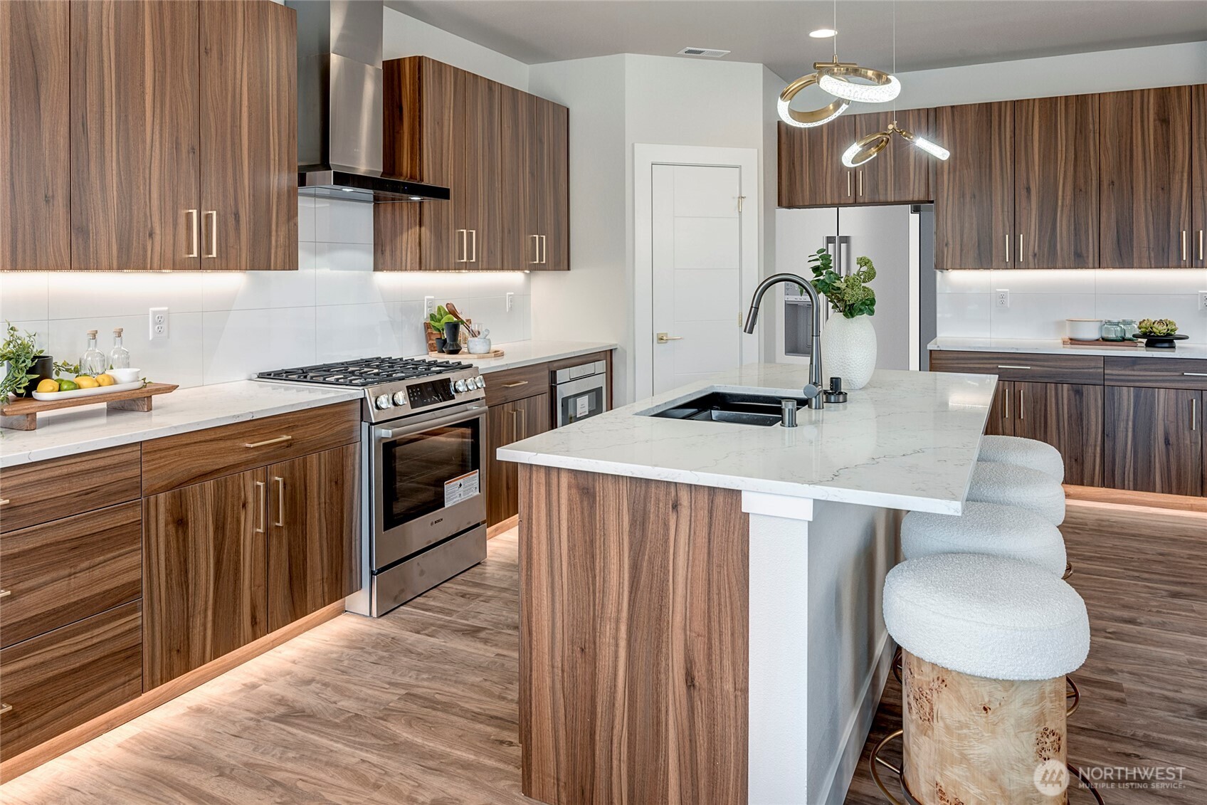 3928 214th Place Southeast, Unit B Bothell, WA 98021 - Photo 6 of 27 a kitchen with a stove a sink and a refrigerator