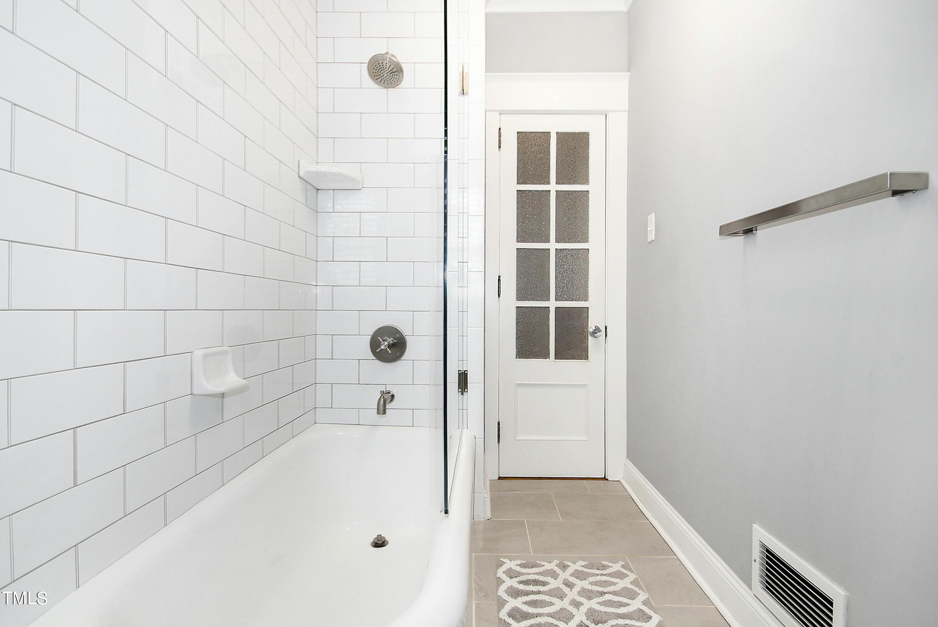 1512 Carr Street Raleigh, NC 27608 - Photo 16 of 60 a bathroom with a bathtub