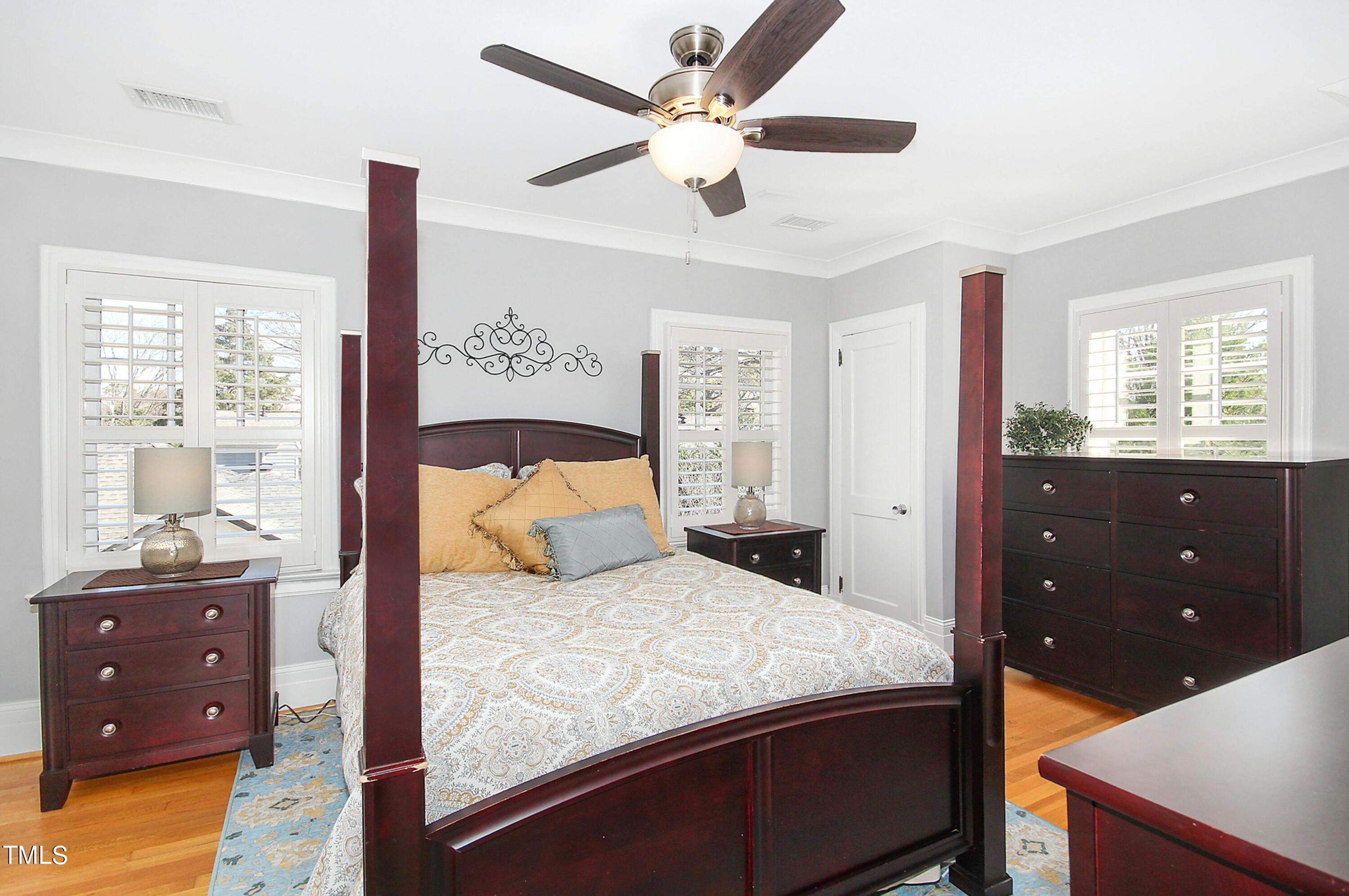 1512 Carr Street Raleigh, NC 27608 - Photo 19 of 60 a bedroom with a bed and a dresser