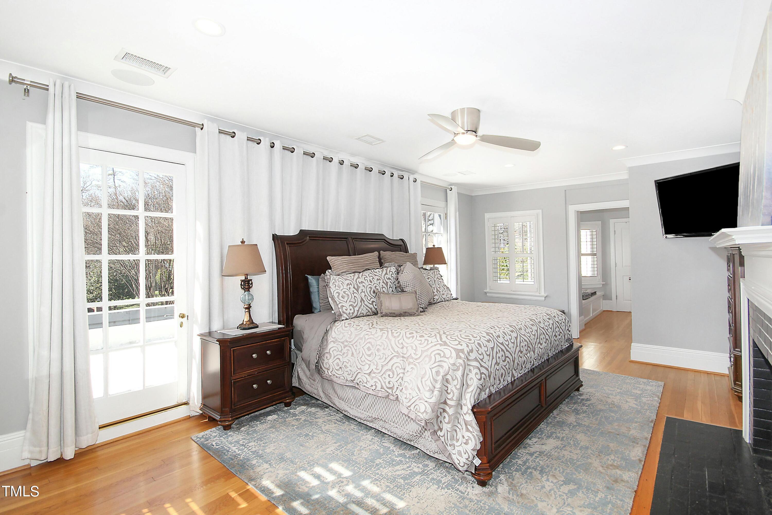 1512 Carr Street Raleigh, NC 27608 - Photo 20 of 60 a bedroom with a bed and a television
