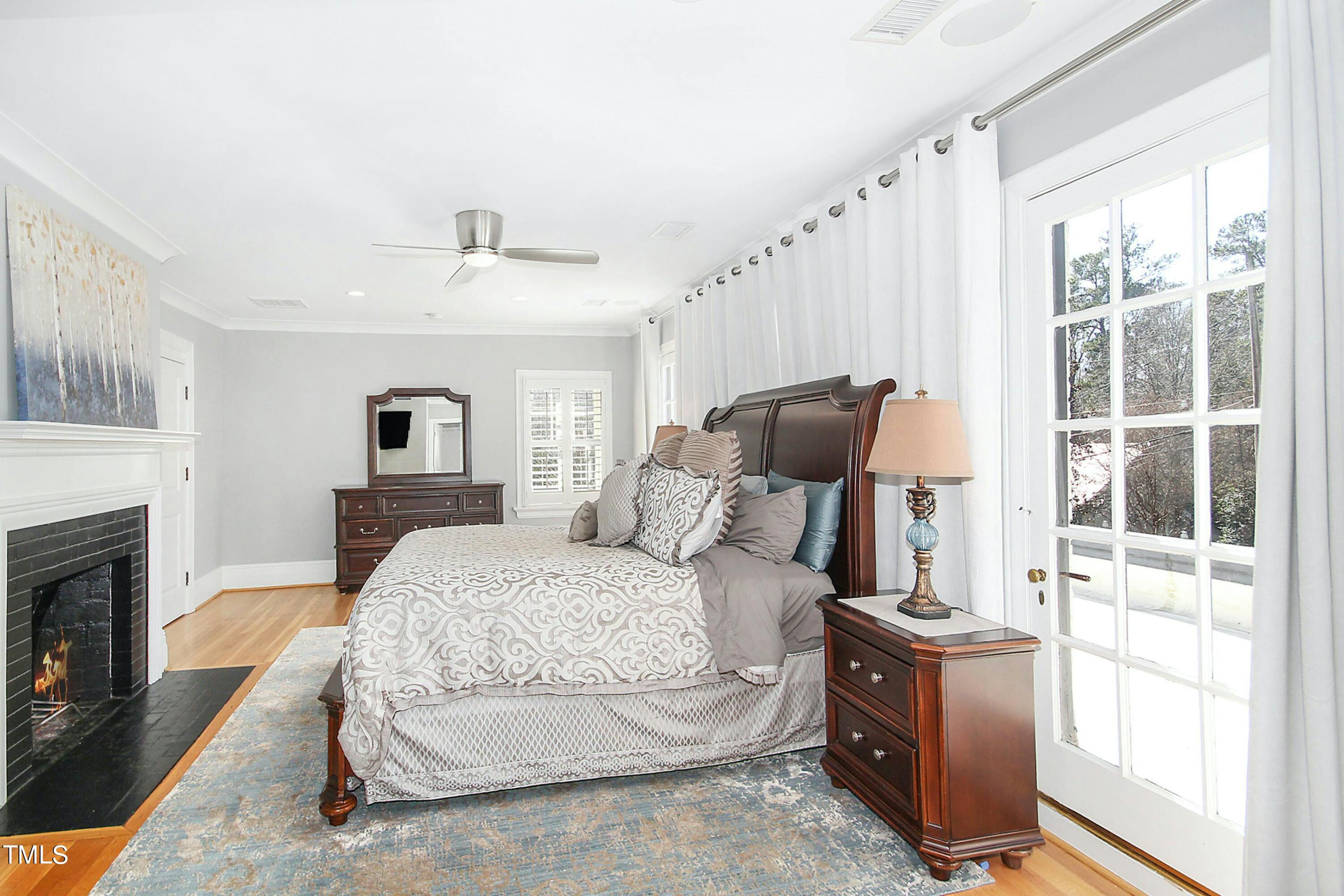 1512 Carr Street Raleigh, NC 27608 - Photo 22 of 60 a bedroom with a bed and a fireplace