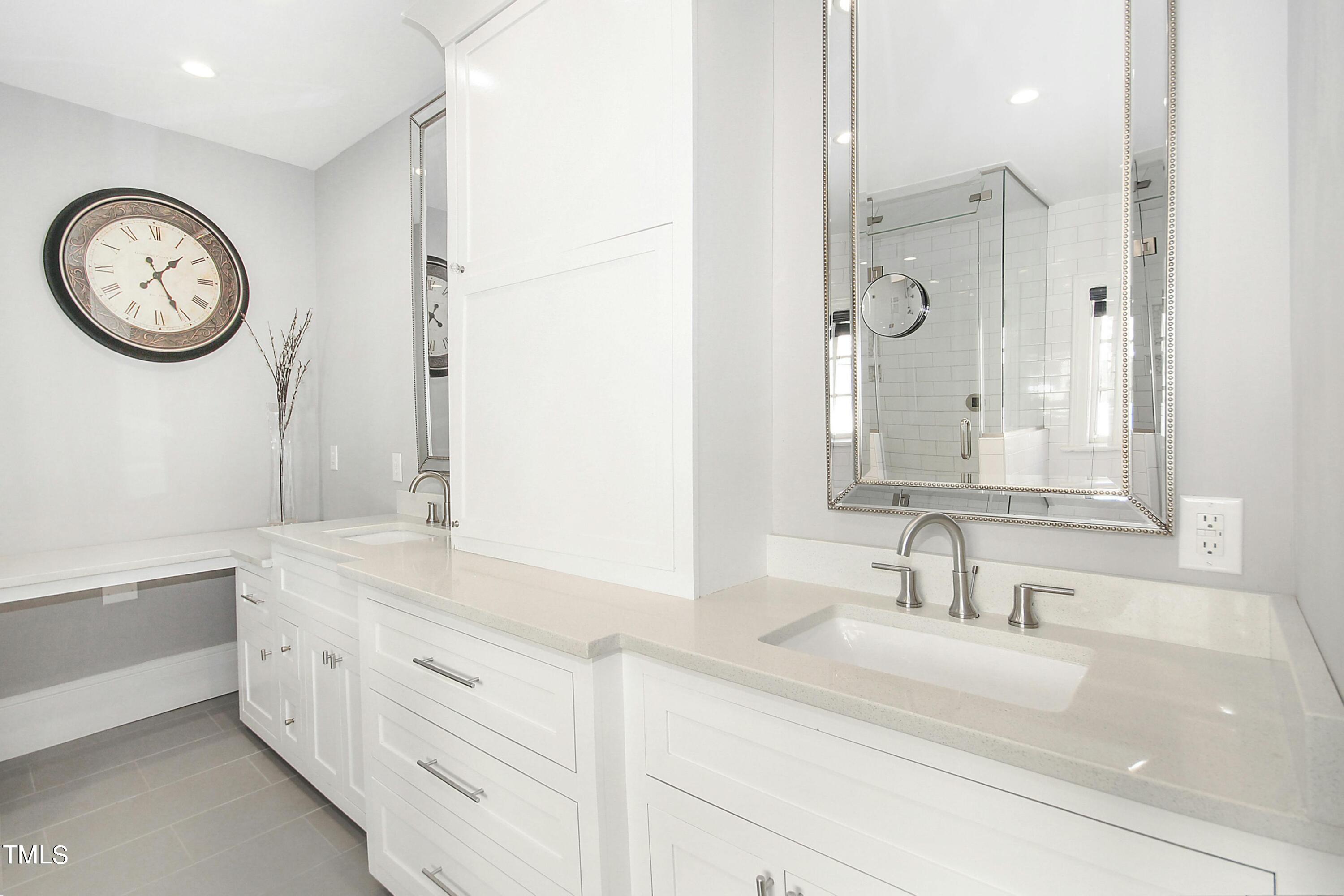 1512 Carr Street Raleigh, NC 27608 - Photo 24 of 60 a bathroom with a sink and a mirror