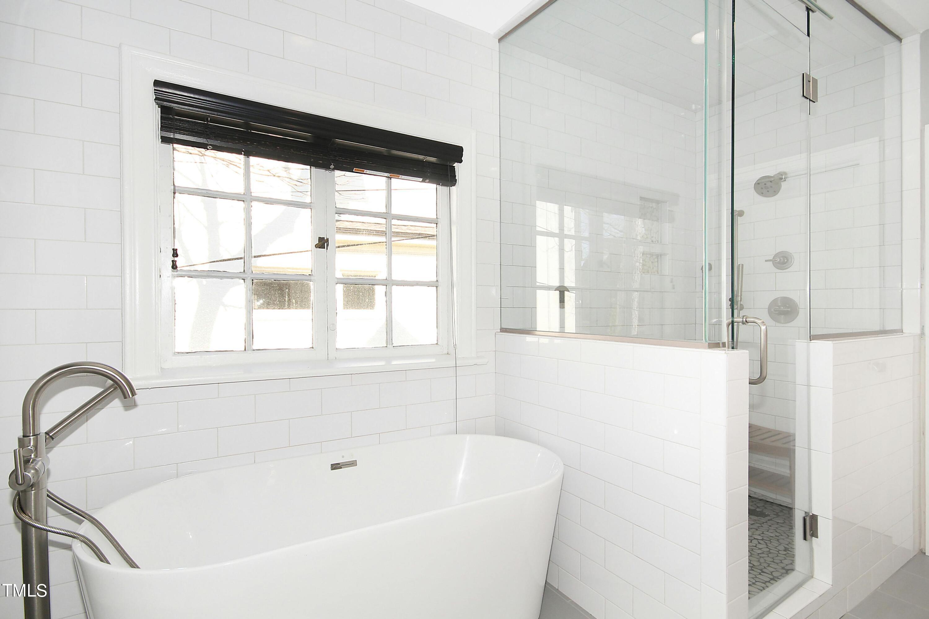 1512 Carr Street Raleigh, NC 27608 - Photo 25 of 60 a white bath tub sitting next to a window
