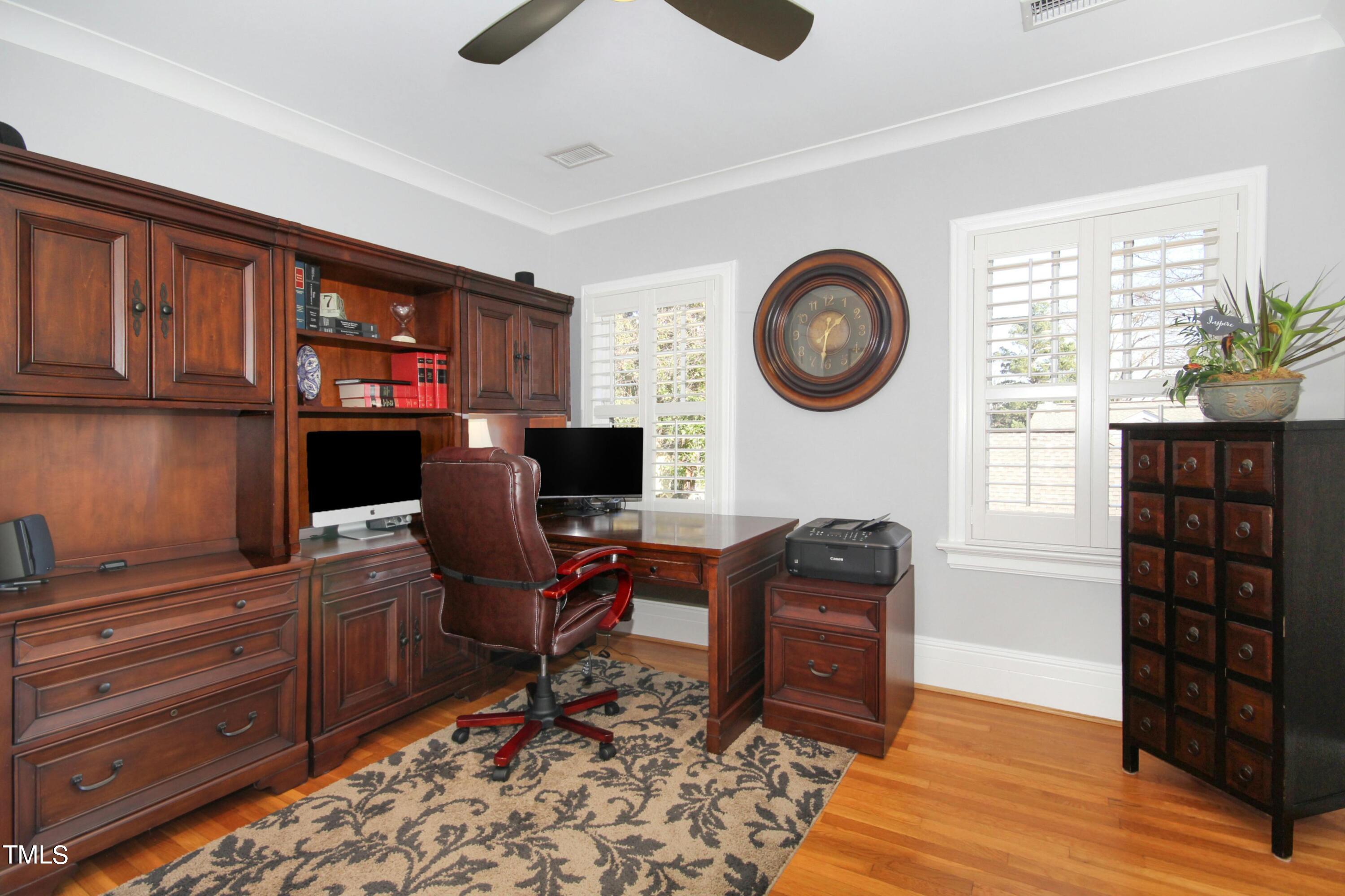 1512 Carr Street Raleigh, NC 27608 - Photo 26 of 60 a view of a workspace with furniture and a window
