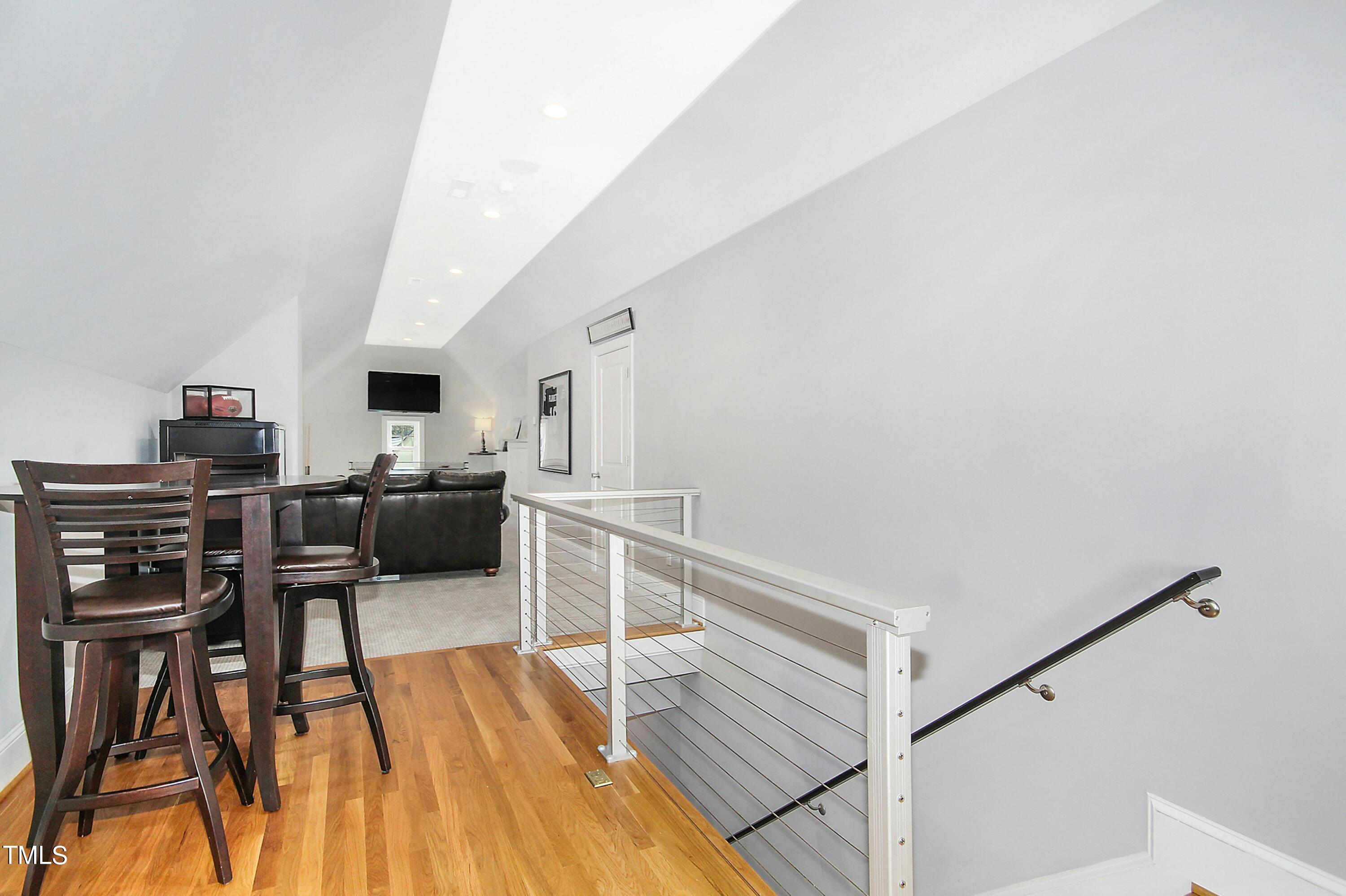 1512 Carr Street Raleigh, NC 27608 - Photo 28 of 60 a view of a workspace with furniture and wooden floor