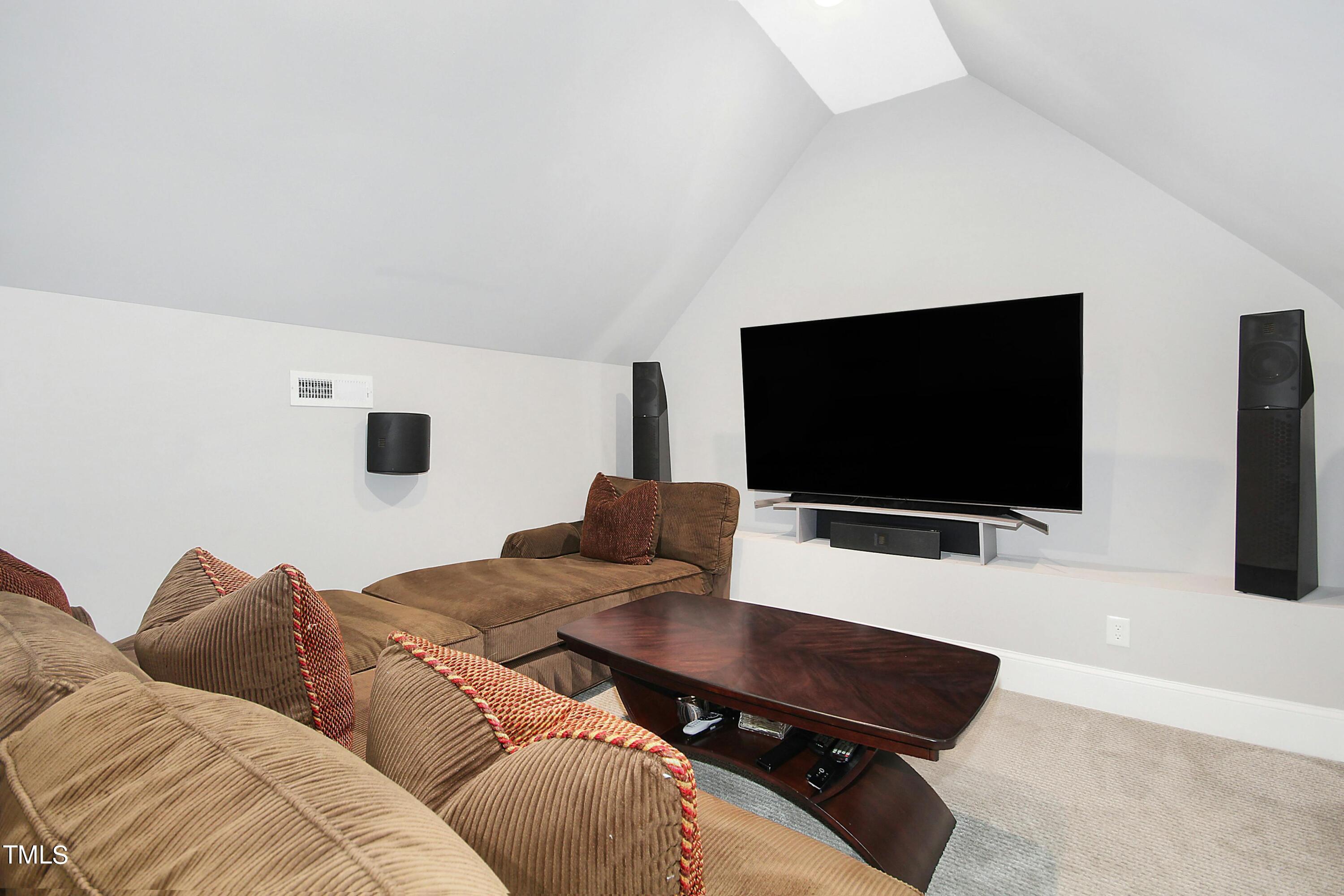 1512 Carr Street Raleigh, NC 27608 - Photo 30 of 60 a living room with furniture and a flat screen tv