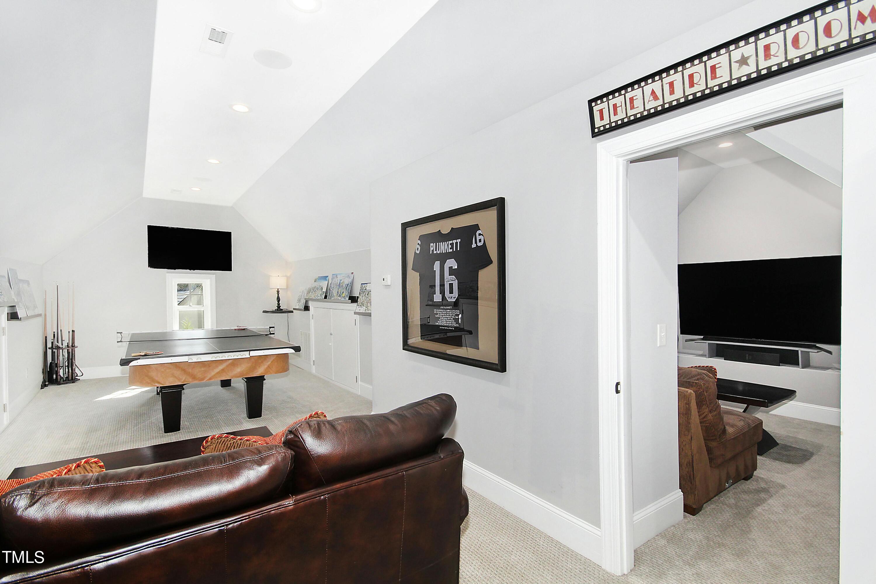 1512 Carr Street Raleigh, NC 27608 - Photo 31 of 60 a work room with furniture and a flat screen tv