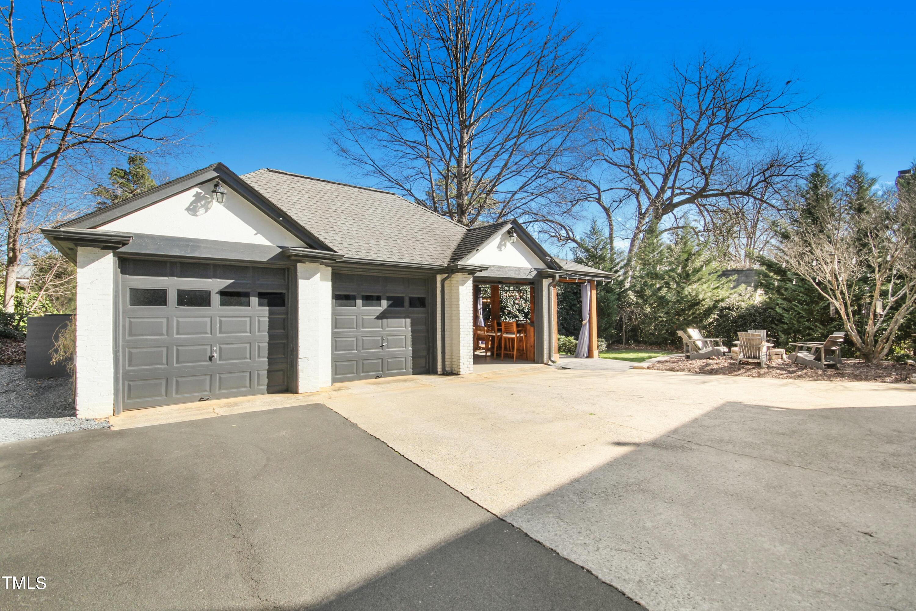 1512 Carr Street Raleigh, NC 27608 - Photo 39 of 60 a front view of a house with a yard and garage